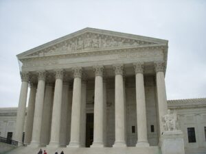 Supreme Court building columns representing legal standard and ordinary care